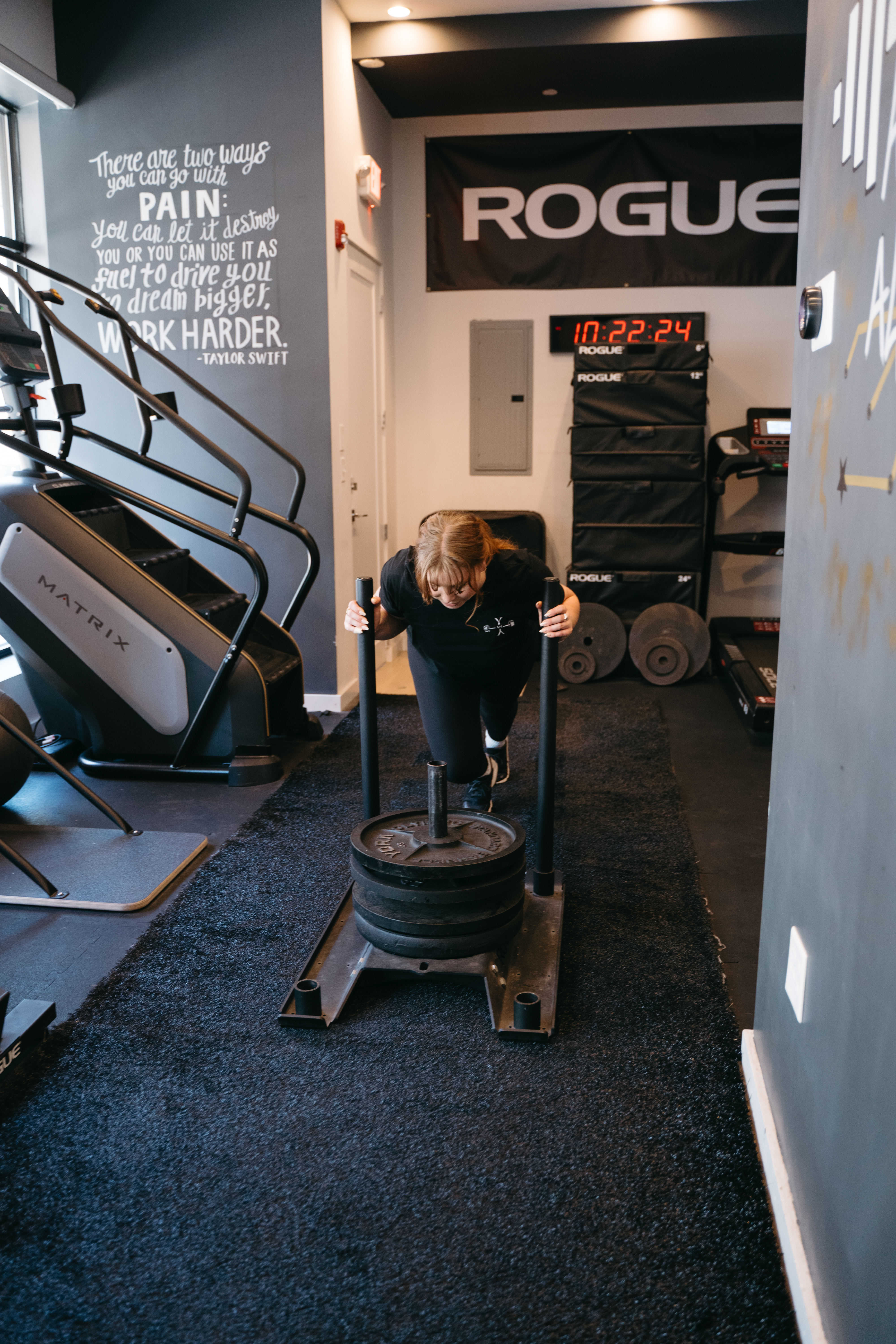 stacey pushing workout sled