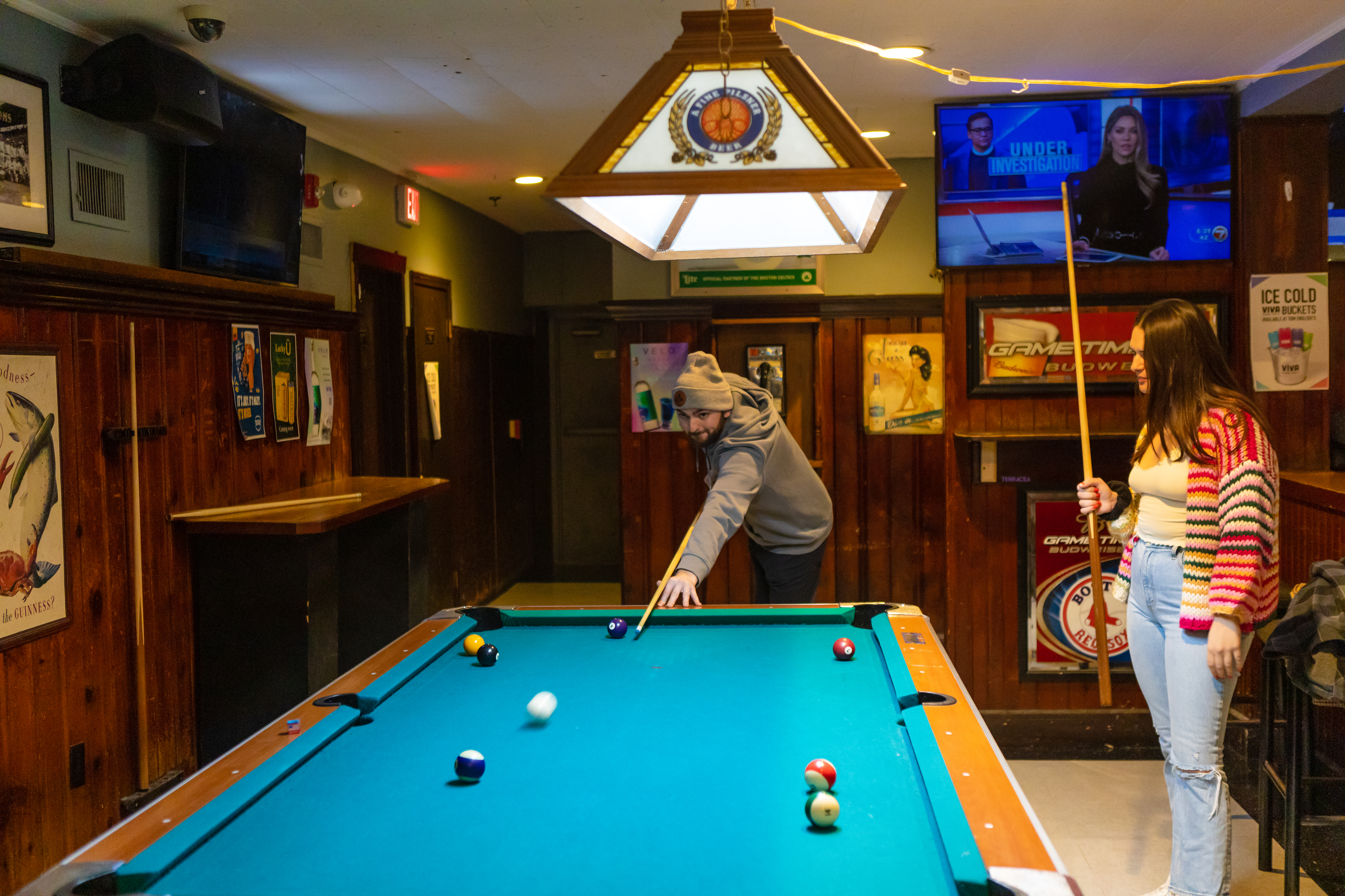 people playing pool at tom englishs